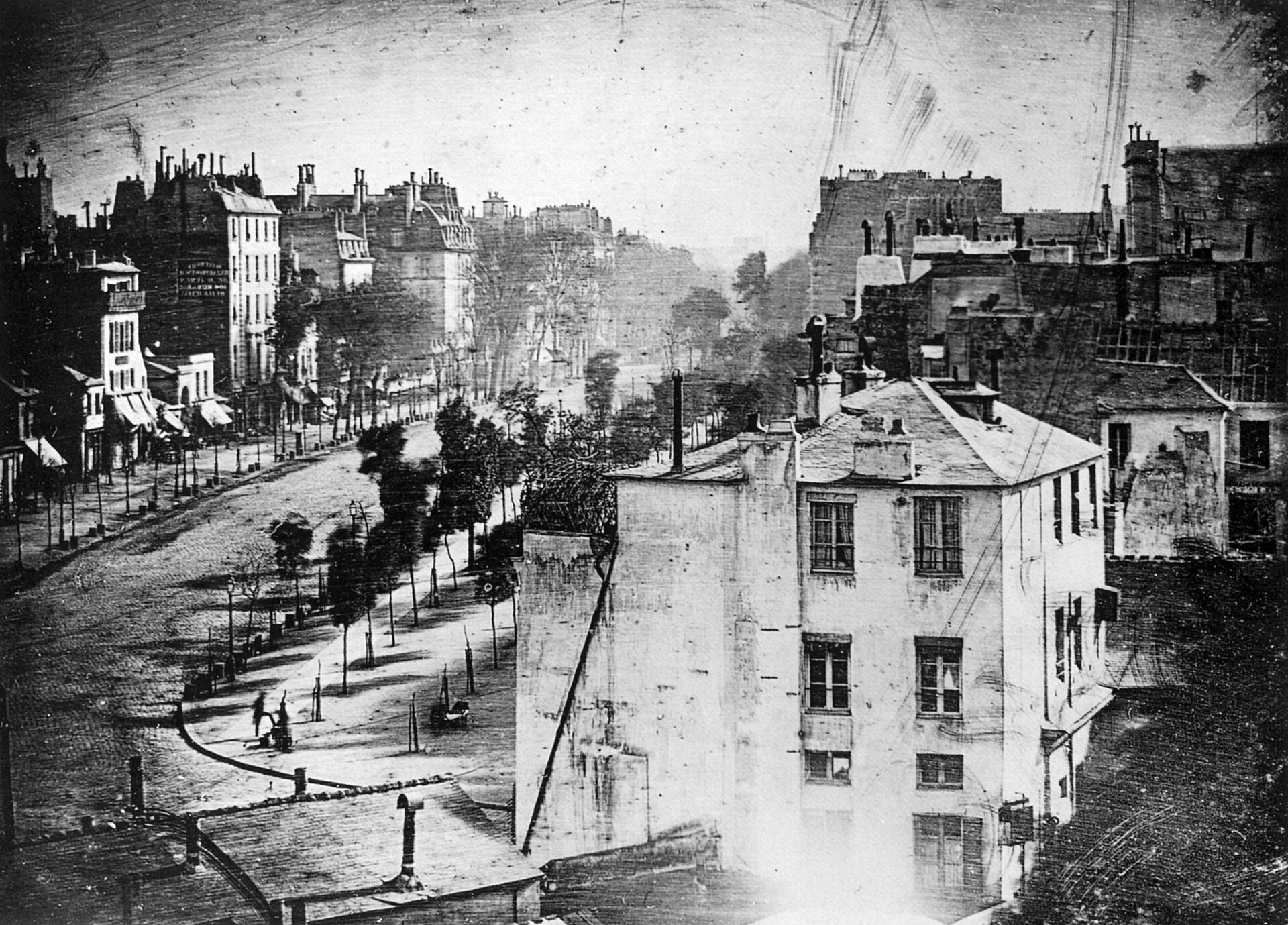 Louis Daguerre's Boulevard du Temple, one of the earliest photographs to show a person.