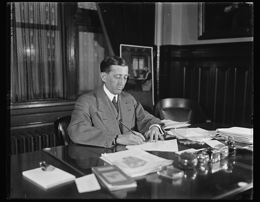 Will H. Hays seated at his desk in 1921.