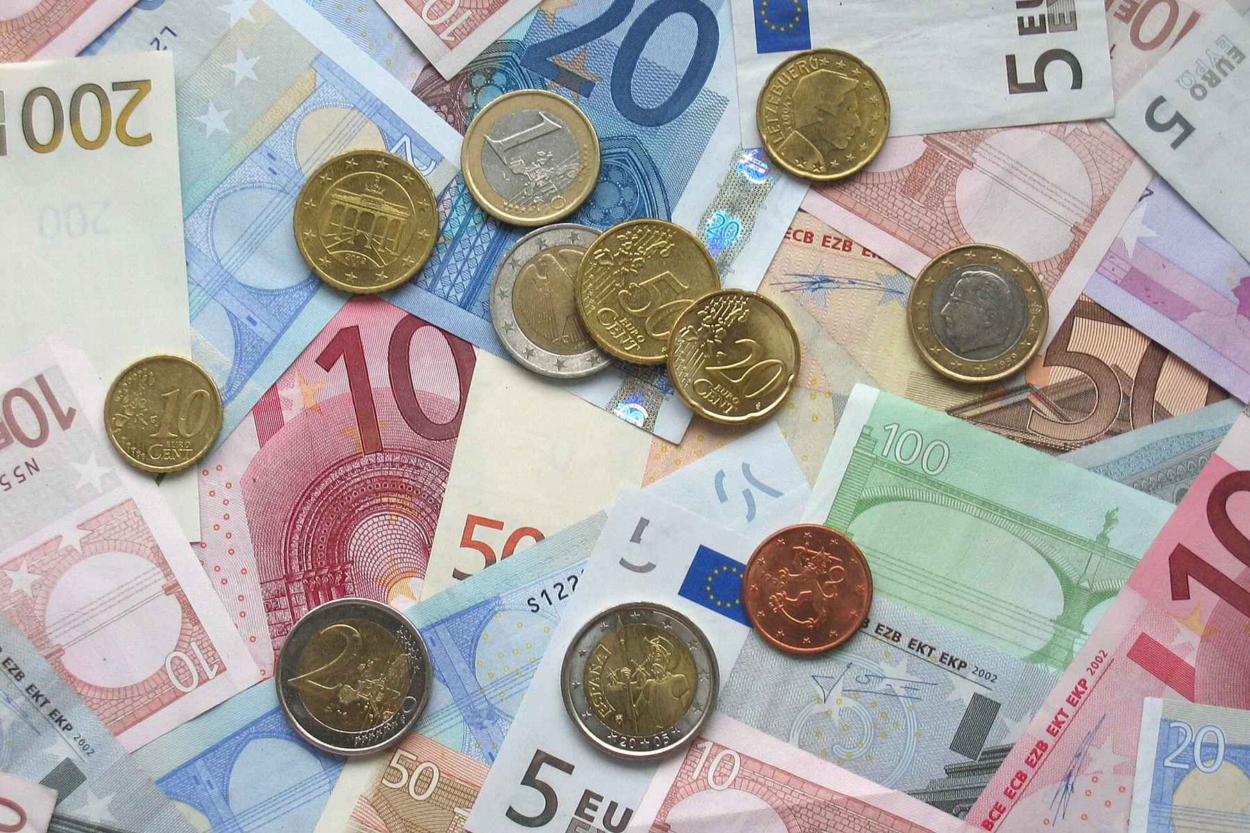 Euro coins and banknotes (cropped), an archival visual related to What Is Money.