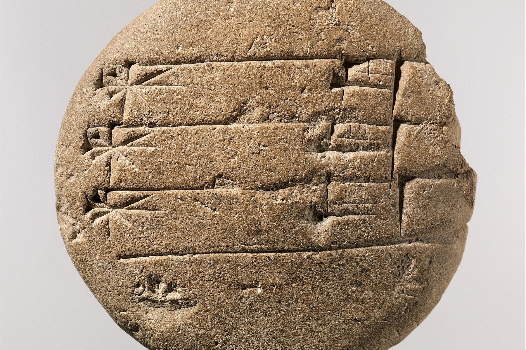 Ancient cuneiform tablet recording knowledge in clay.