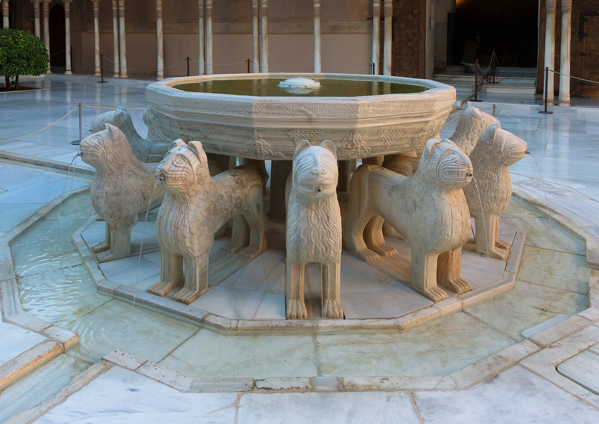 Lion fountain and arcades in the Court of the Lions at Alhambra.