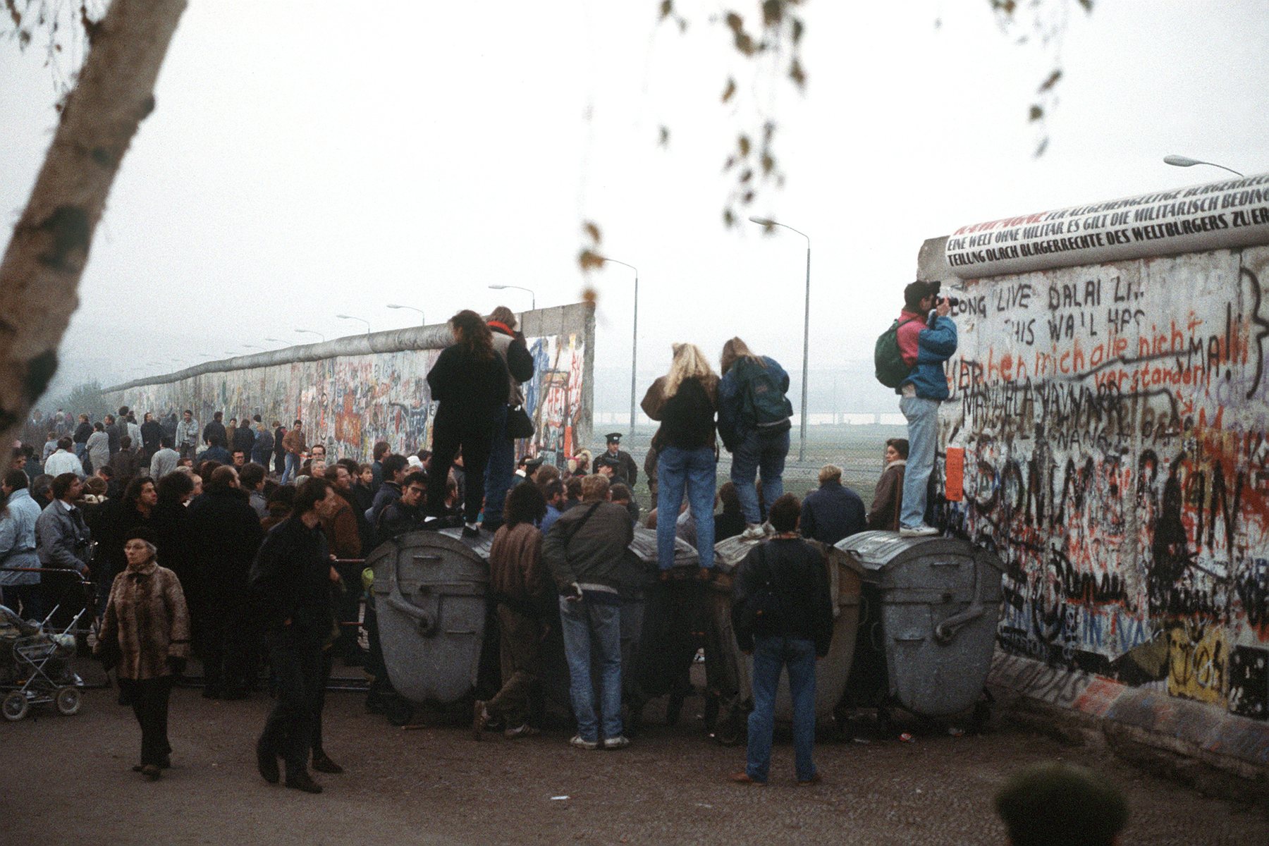 West German citizens gather at a newly created opening in the Berlin Wall at Potsdamer Platz on 14 November 1989.