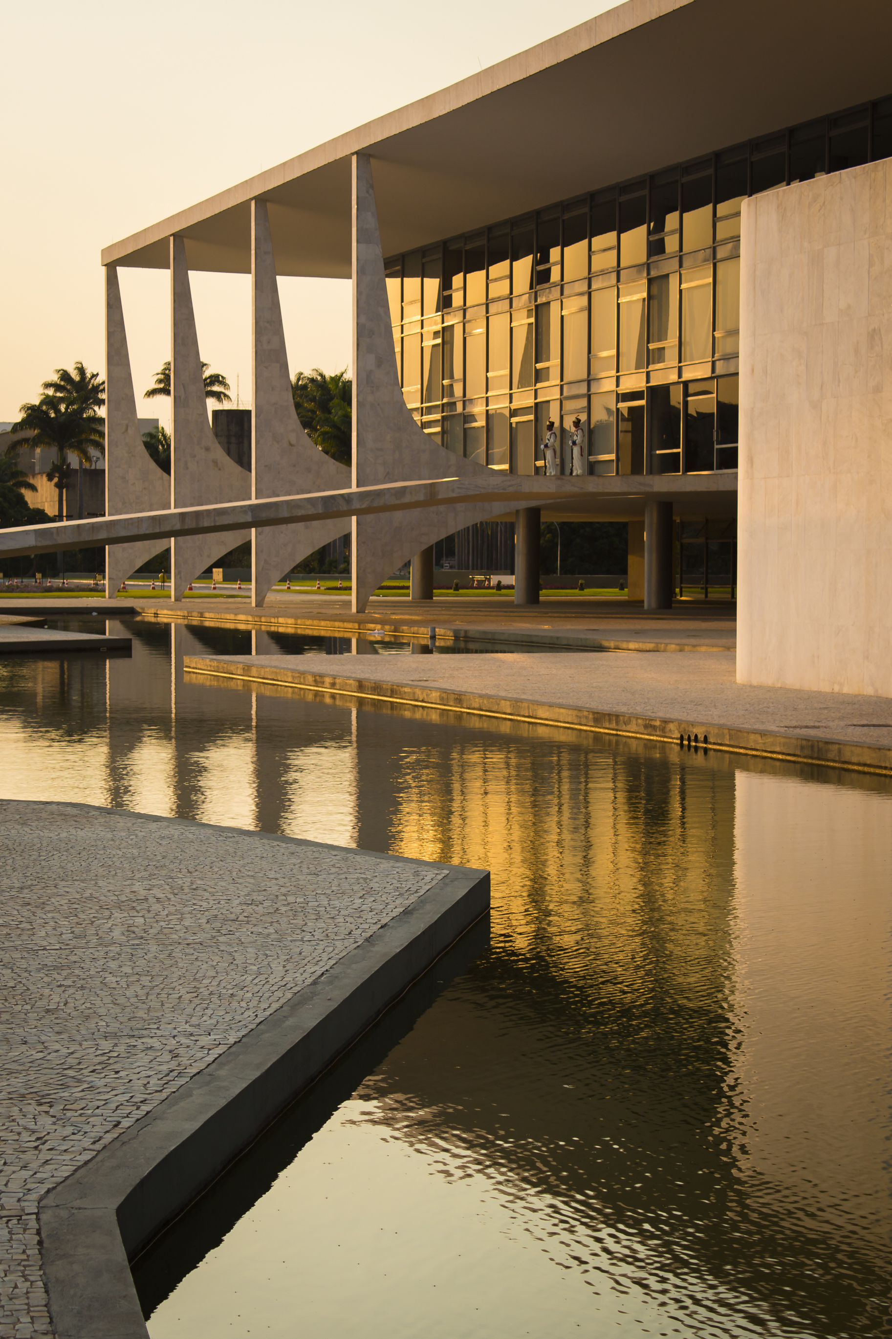 Oscar Niemeyer's Palácio do Planalto reflected at sunset.