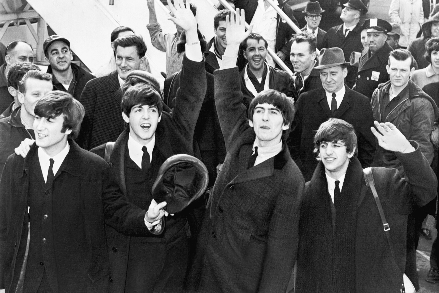 The Beatles arriving at JFK Airport in 1964 as music audiences became increasingly global.