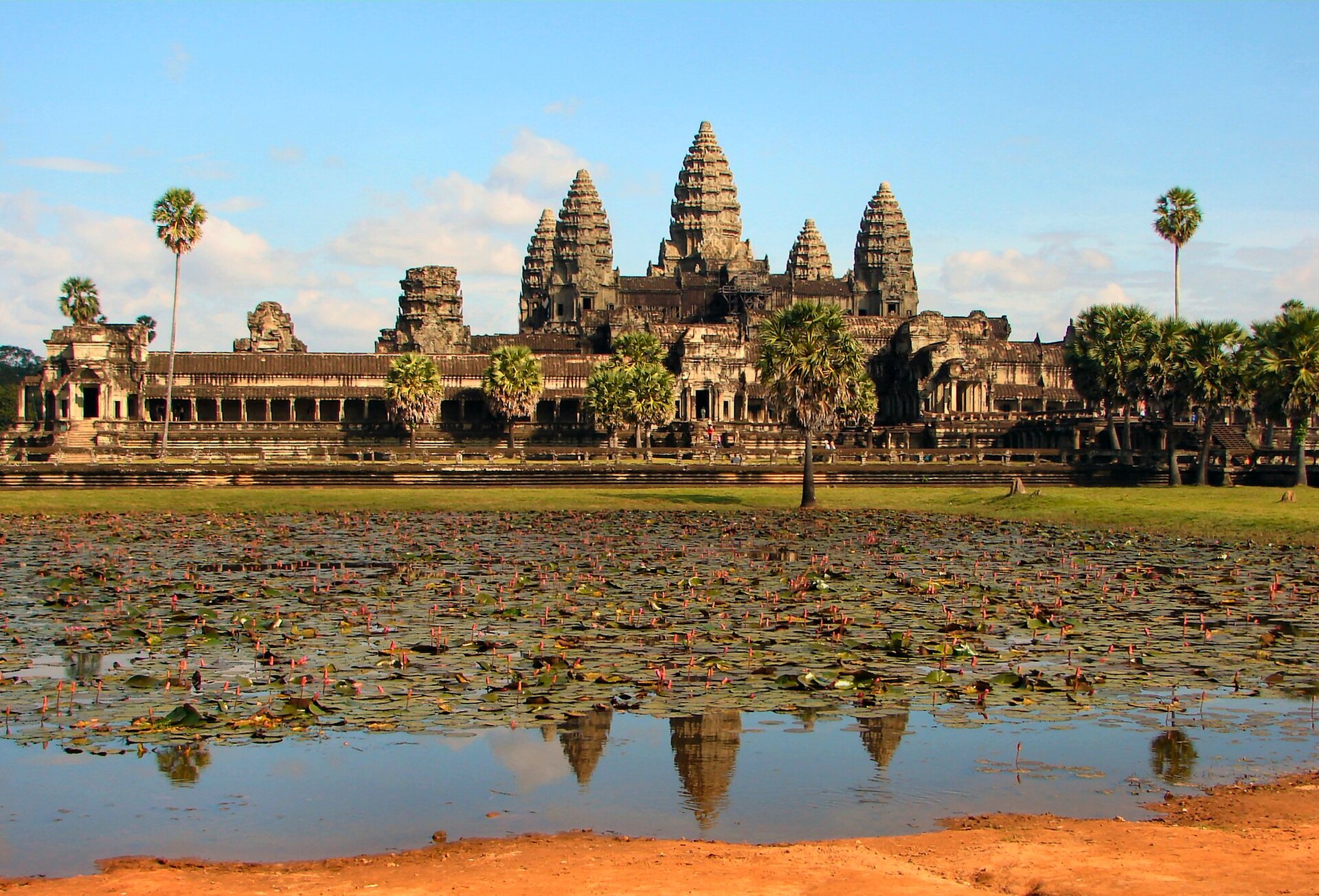 The towers of Angkor Wat reflected at dusk.