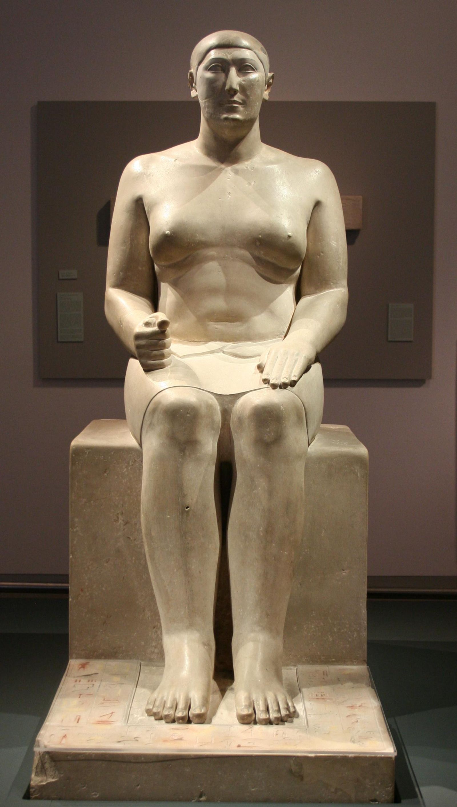 Statue of Hemiunu from his tomb at Giza. Limestone. H 155.5 cm (IN 1962) Roemer- und Pelizaeusmuseum, HildesheimThe hieroglyphs at the feet of Hemiunu, are now protected under a Plexiglass plate: (the