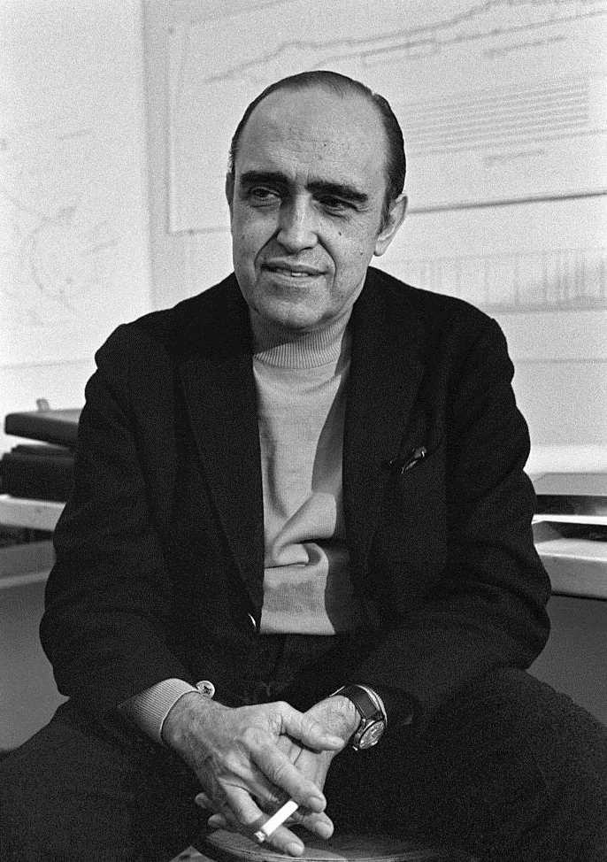 Brazilian architect Oscar Niemeyer (Oscar Ribeiro de Almeida Niemeyer Soares Filho) posing smiling in his studio. The Italian publisher Giorgio Mondadori has recently commissioned the architect to bui